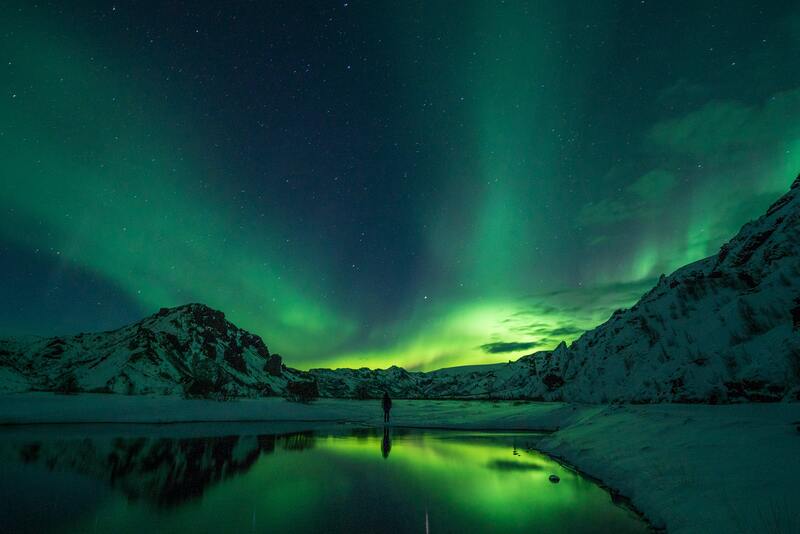 Aurora Borealis over an Arctic landscape